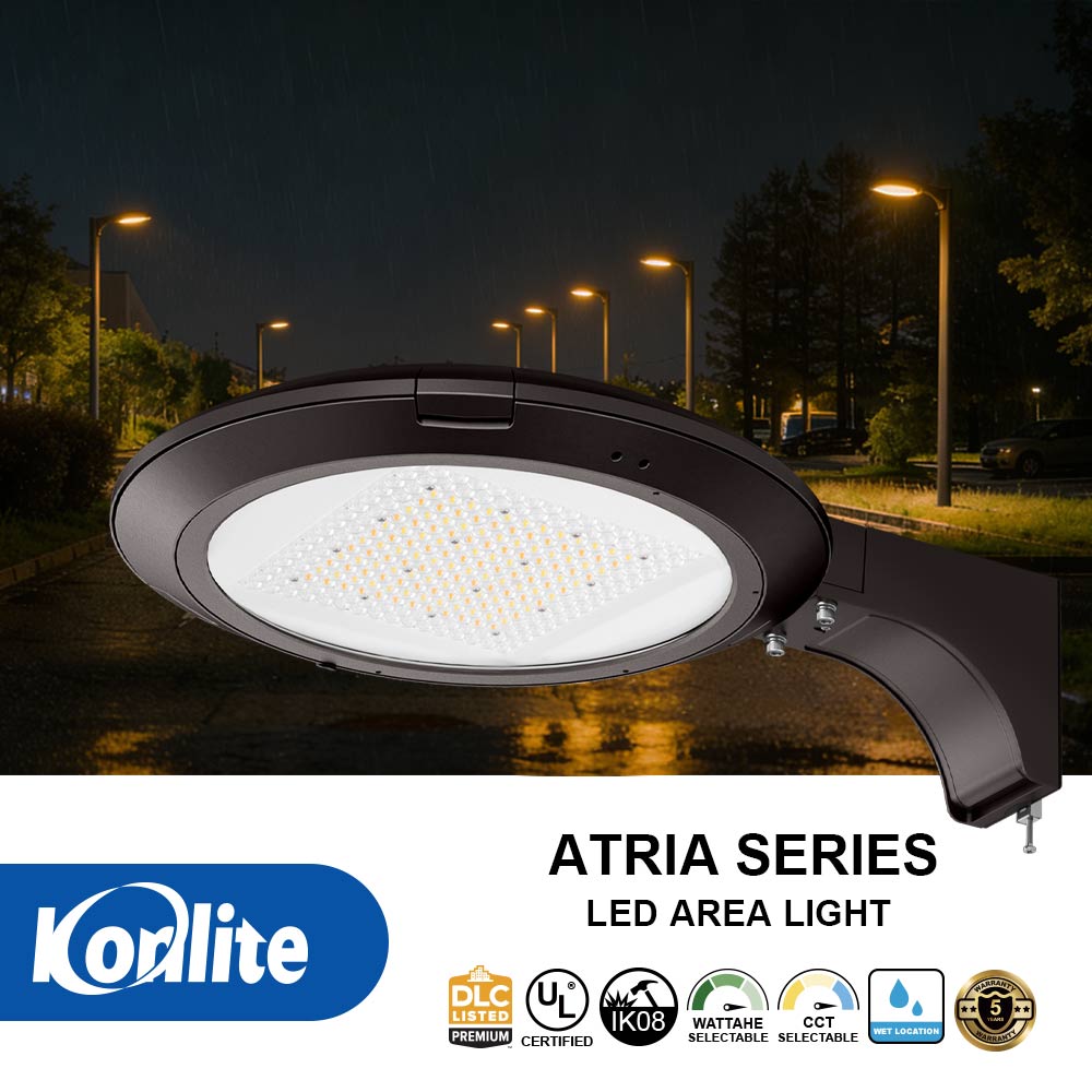 Konlite Atria Series LED area light on a dark street with surrounding lights.