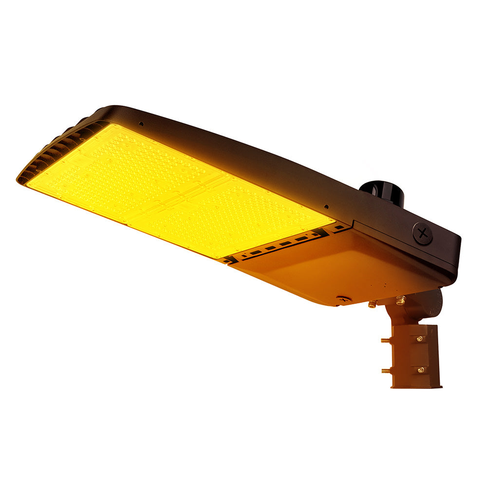 Vela Amber LED Area Light in Dark Bronze with slipfitter and photocell.