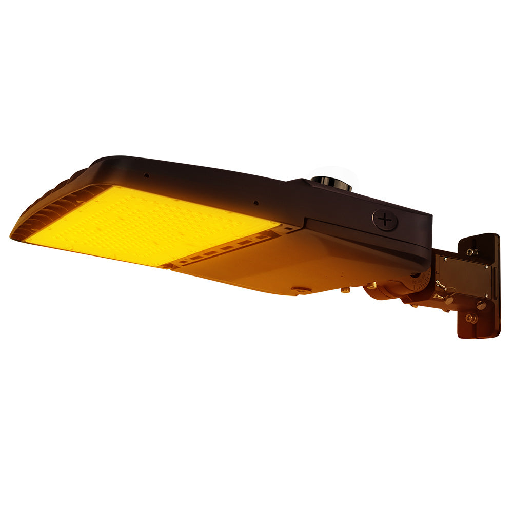 Vela Amber LED Area Light in Dark Bronze with universal mount and Shorting Cap.