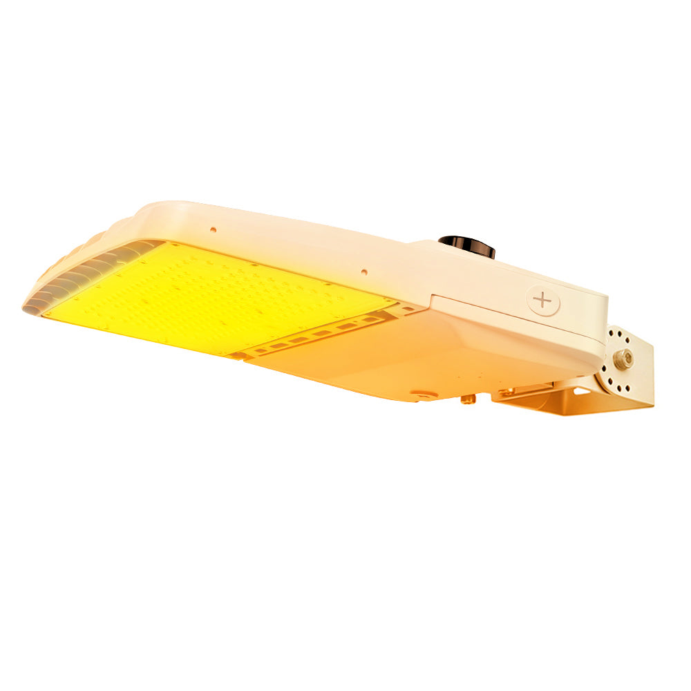 Vela Amber LED Area Light in white with yoke and shorting cap