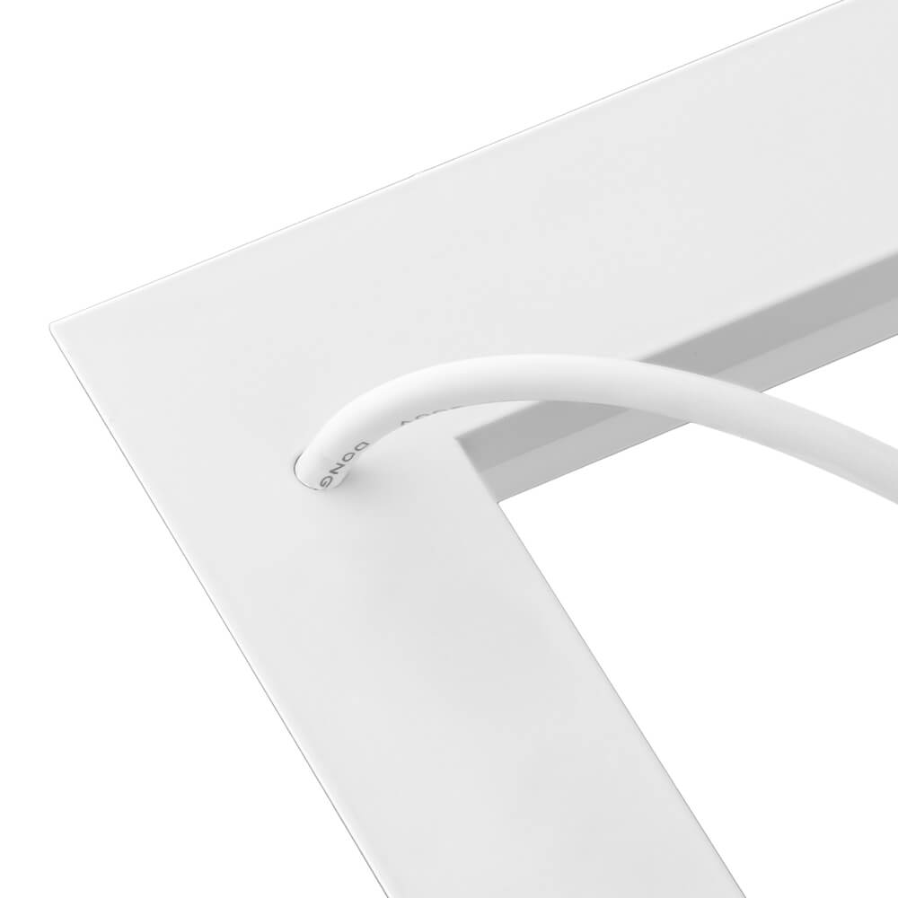 Close-up of a white chair Konlite 2x2 ft LED Frame light fixture
