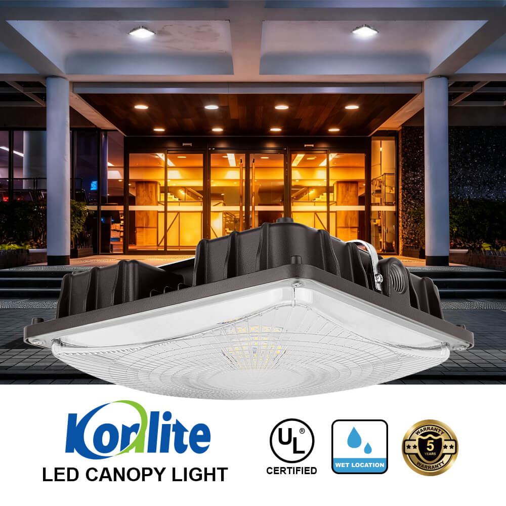 LED canopy light with Konlite branding and certification logos in front of a building exterior.