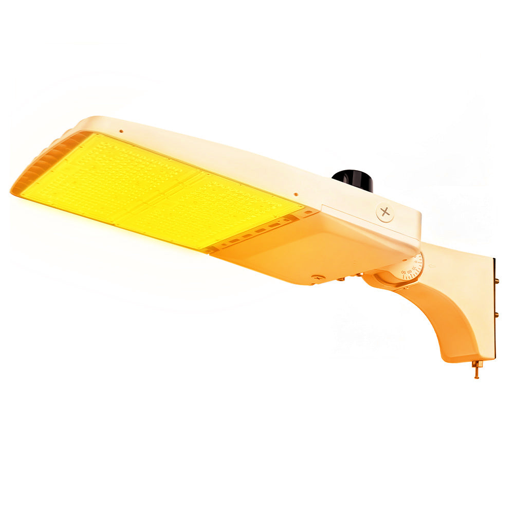 Vela Amber LED Area Light in white with extrusion arm and photocell
