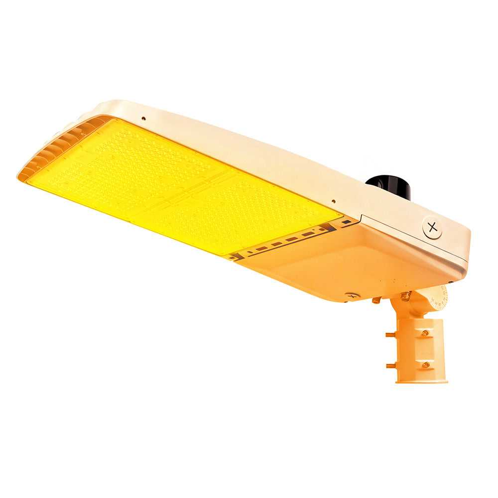 Vela Amber LED Area Light in white with slipfitter and photocell.