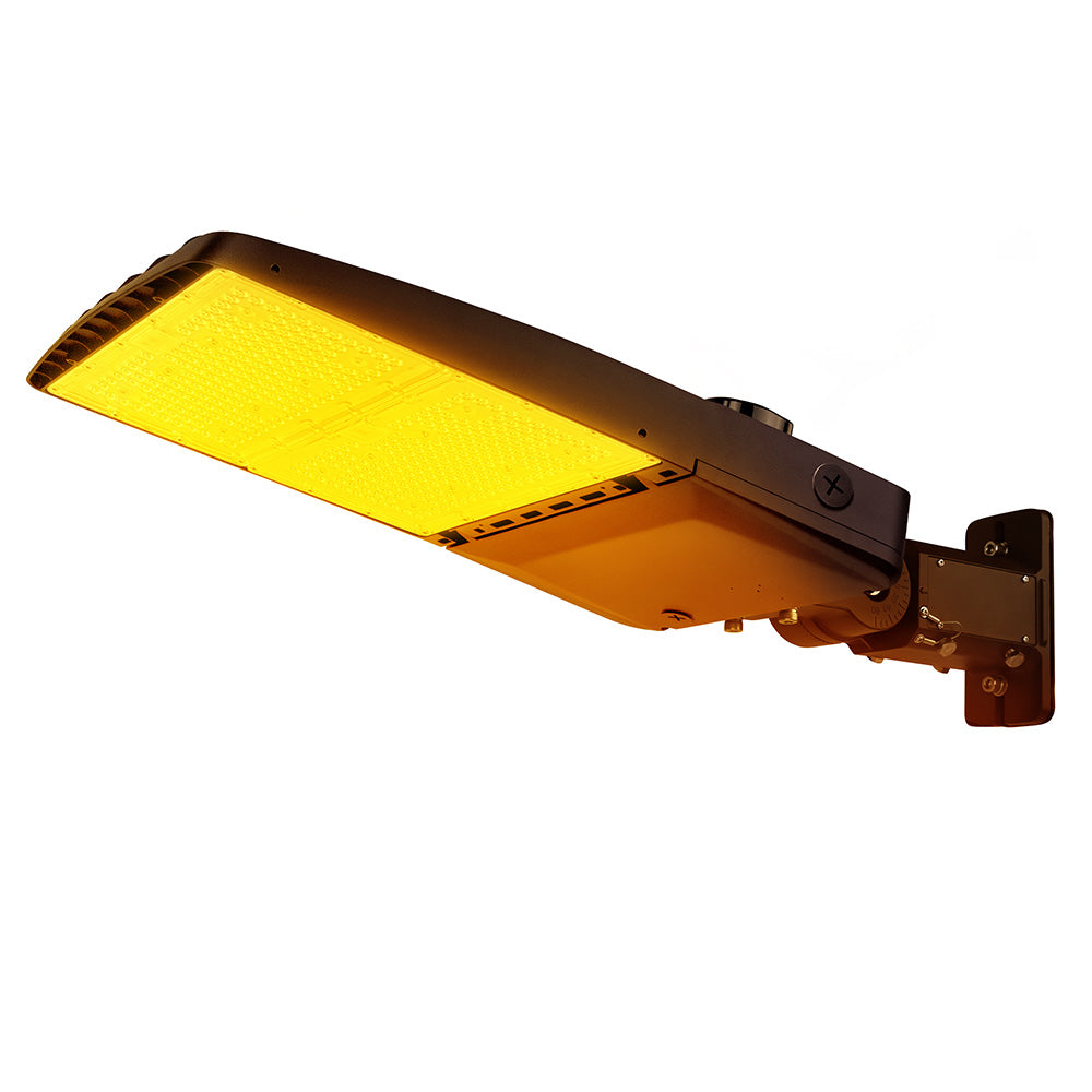 Vela Amber LED Area Light in Dark Bronze with universal mount and Shorting Cap.