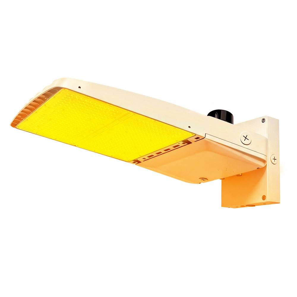 Vela Amber LED Area Light in white with wall mount and photocell.