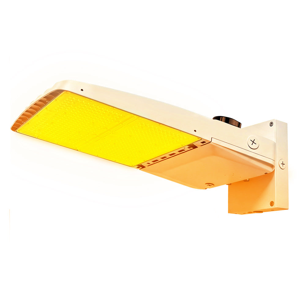 Vela Amber LED Area Light in white with wall mount and shorting cap.