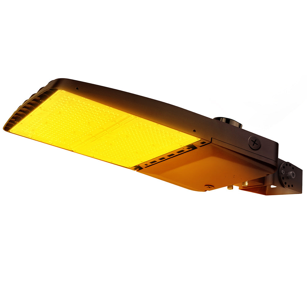 Vela Amber LED Area Light in Dark Bronze with yoke mount and shorting cap.