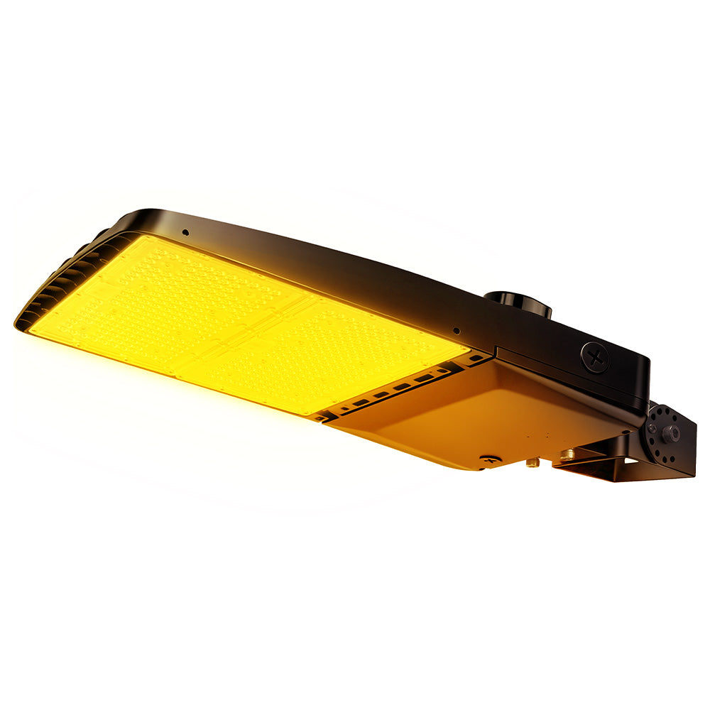 Vela Amber LED Area Light in black with yoke mount and shorting cap.