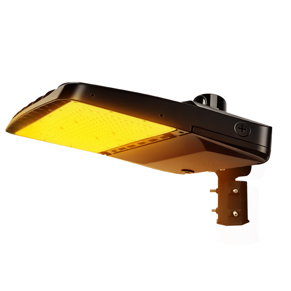 Vela Amber LED Area Light in black with slipfitter and photocell
