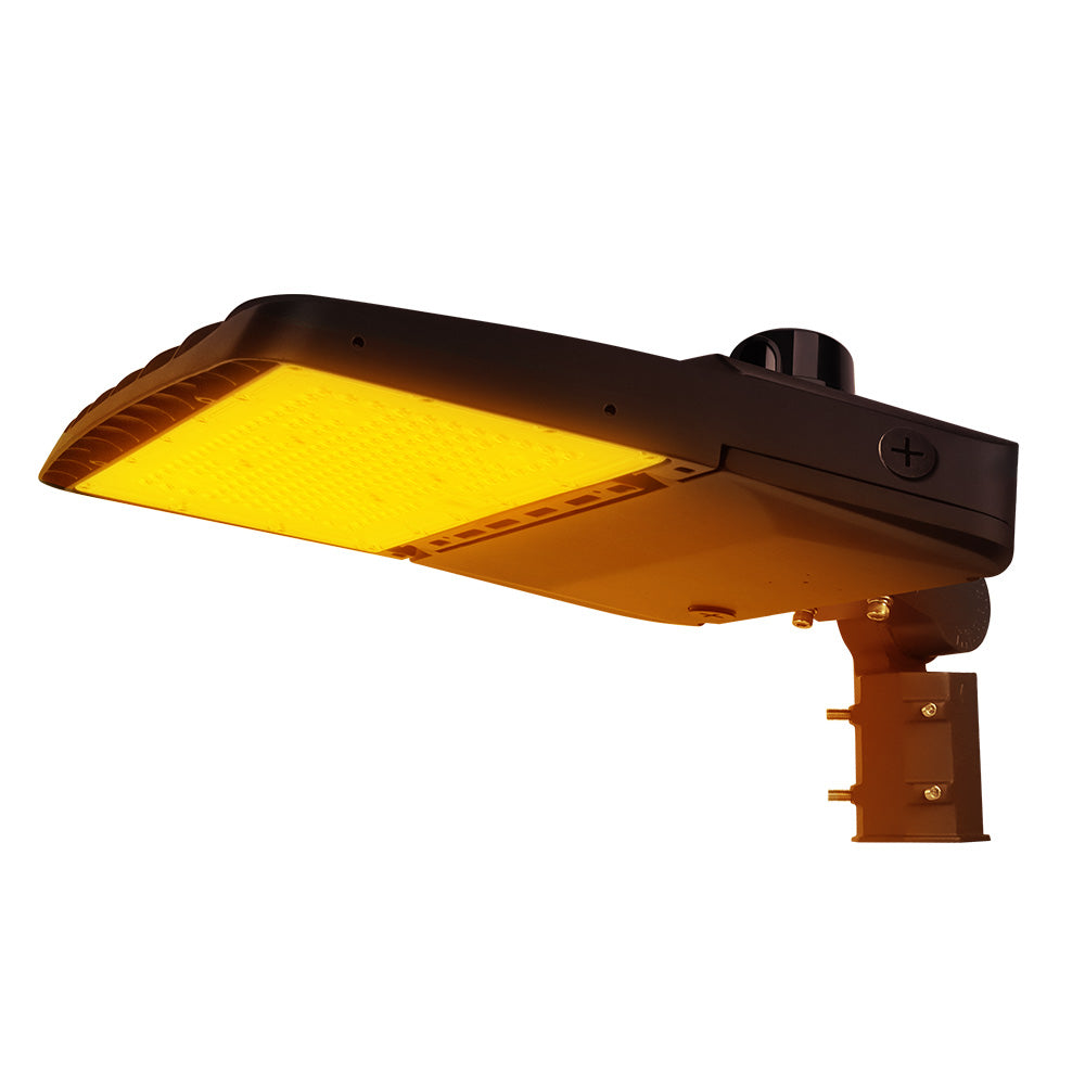 Vela Amber LED Area Light in Dark Bronze with slipfitter and photocell.