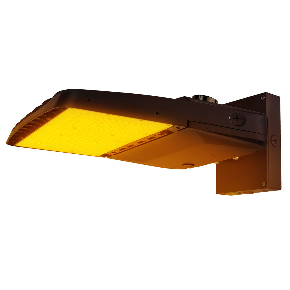 Vela Amber LED Area Light in Dark Bronze with wall mount and Shorting Cap.